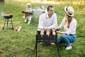 A Woman Lay On The Ground At A Birthday Party While Her Husband Acted Calm