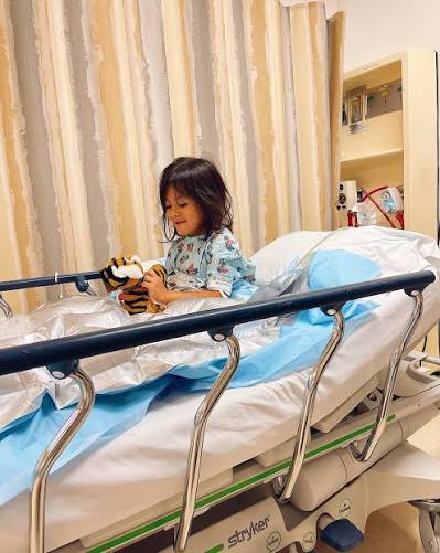 A little girl was trying to sell her dolls to pay for her surgery. Then a billionaire recognized her last name